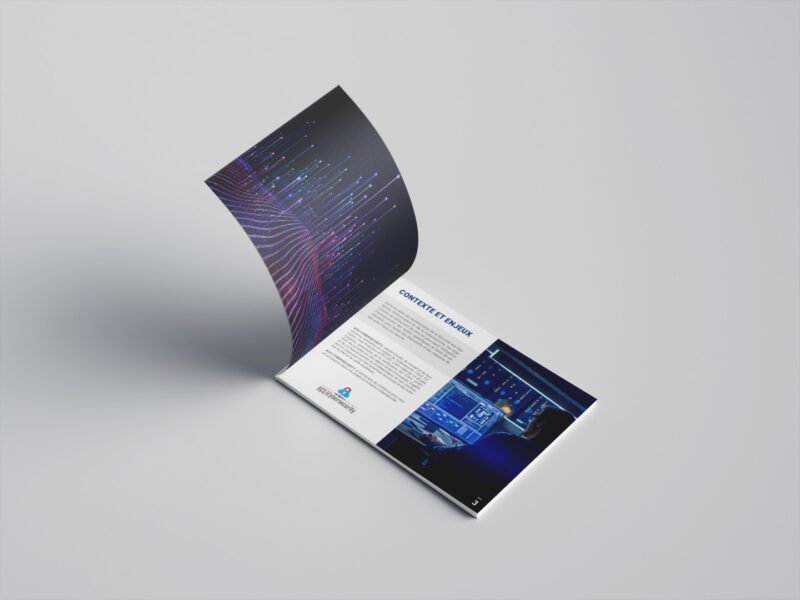 Brochure ouverte avec design graphique moderne et éléments numériques, illustrant un projet de communication visuelle.